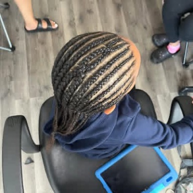 Neat stitch braid style with clean parting by Ravishing Beauté